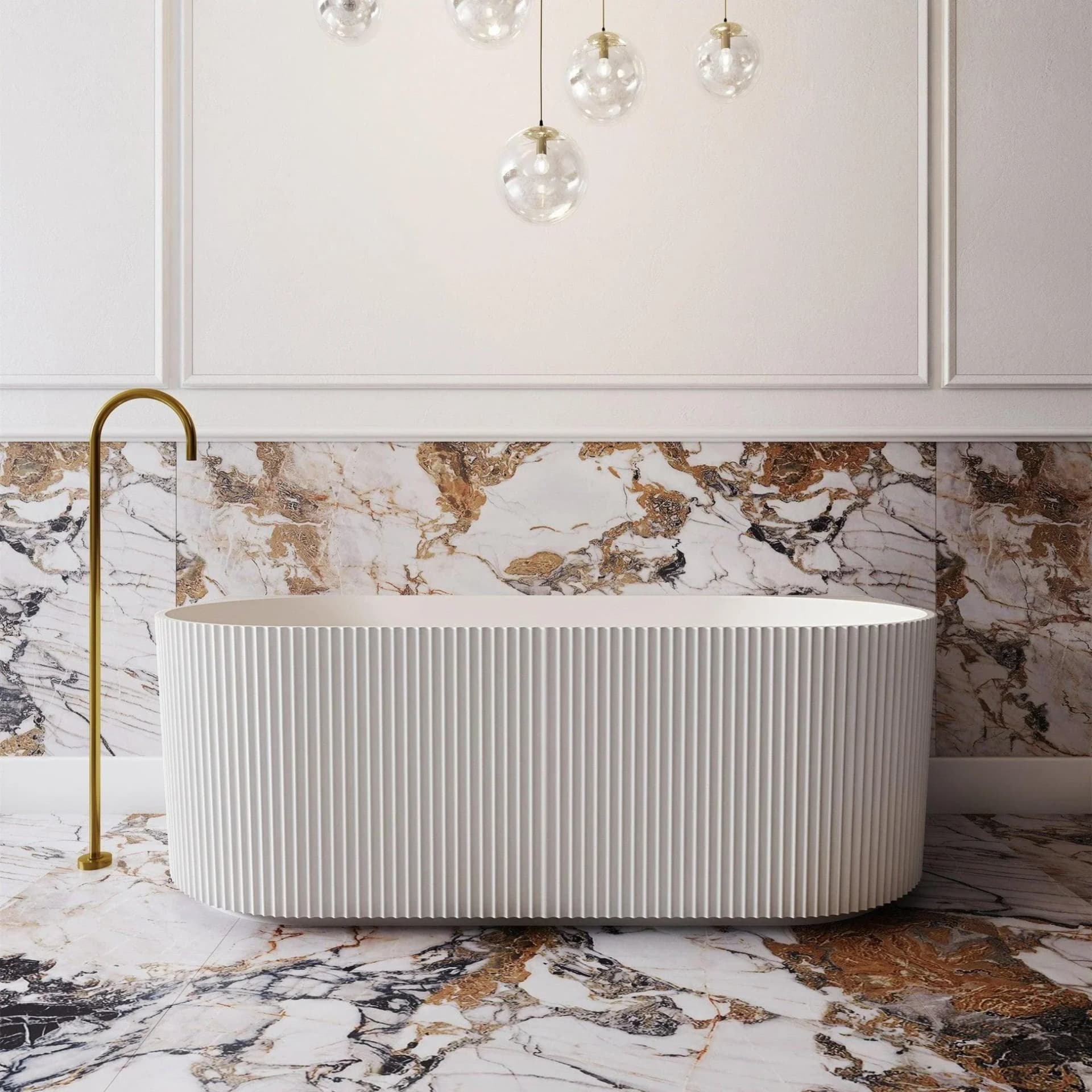 Statement fluted bathtub on veined marble with brass fixture